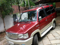 Metallic Maroon Toyota Qualis