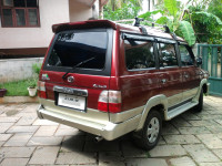 Metallic Maroon Toyota Qualis