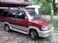 Metallic Maroon Toyota Qualis