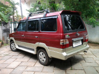 Metallic Maroon Toyota Qualis